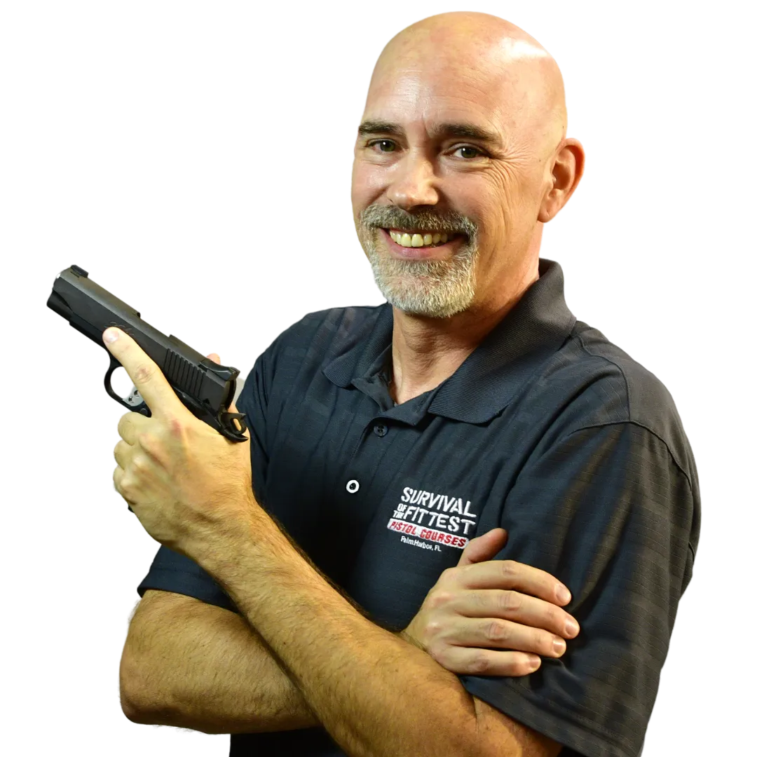firearm safety class instructor James Dowler	holding gun