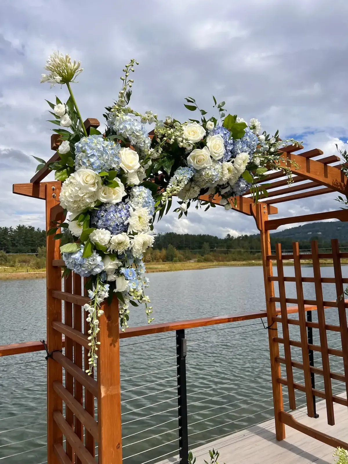 Marblehead MA ceremony and arch florals for elegant outdoor waterfront weddings