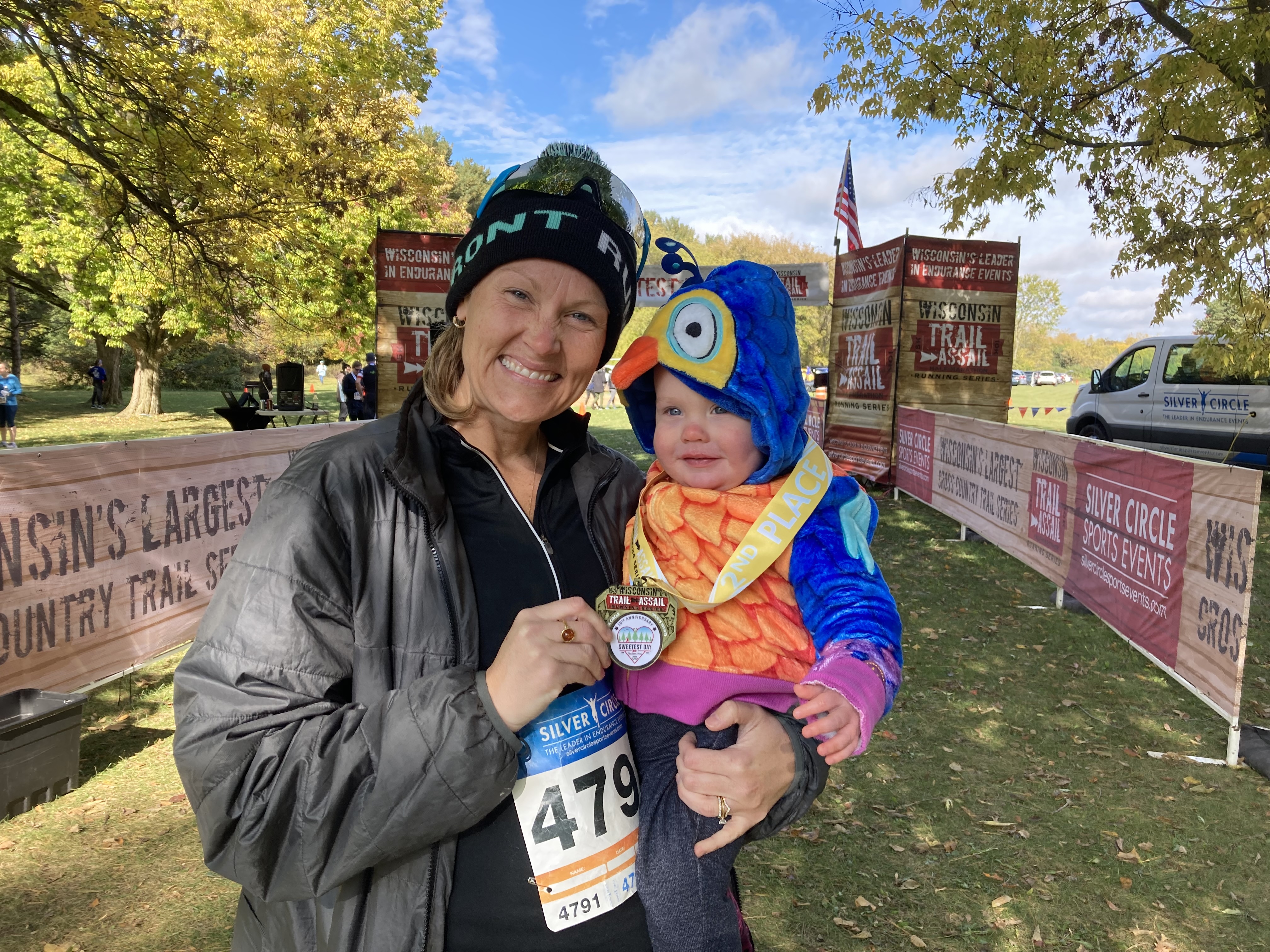 Dr Beth and child at trail running finish line