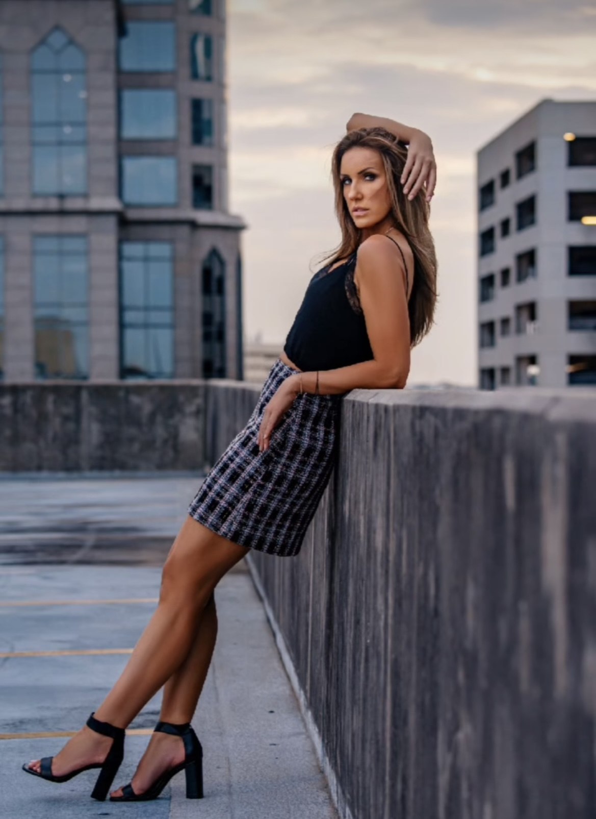 Bozena Zag on a city rooftop against the skyline