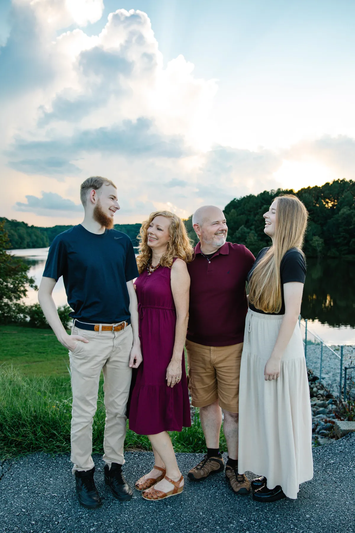 a woman looks at her adult son, a dad looks at his adult daughter
