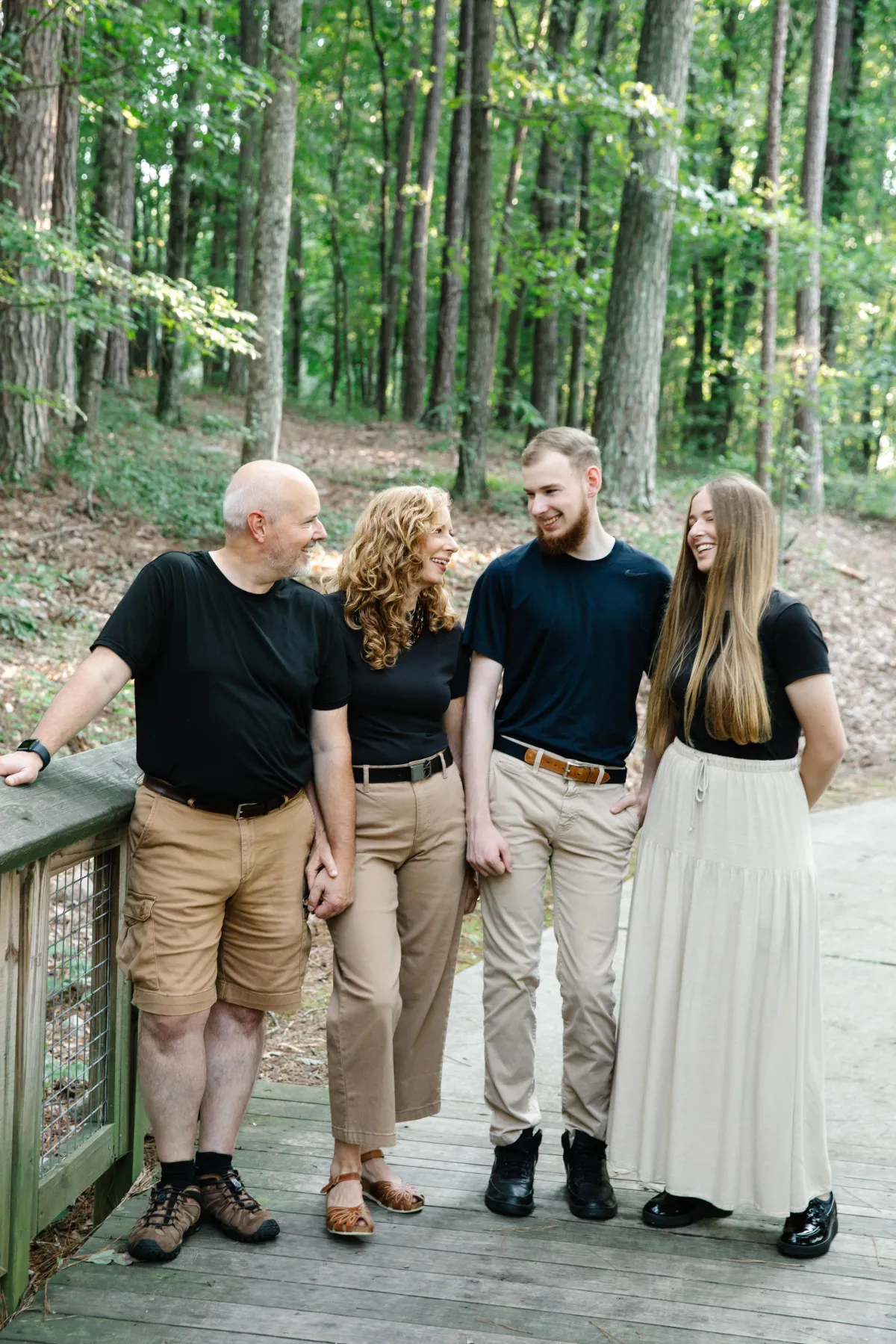 Mom talking to her adult children, husband looks on
