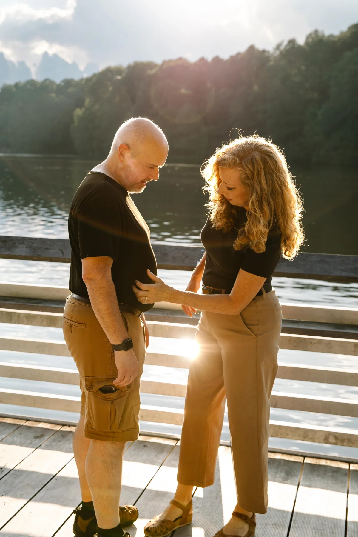 a wife fixing her husband shirt