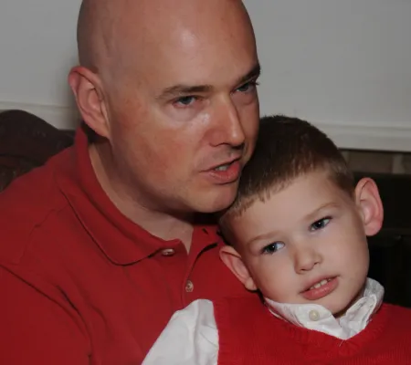 dad talks to his wife and college age son and daughter young adult parenting