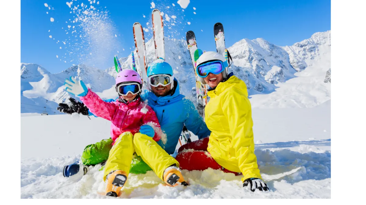 2 women in red and blue suit climbing on brown rock