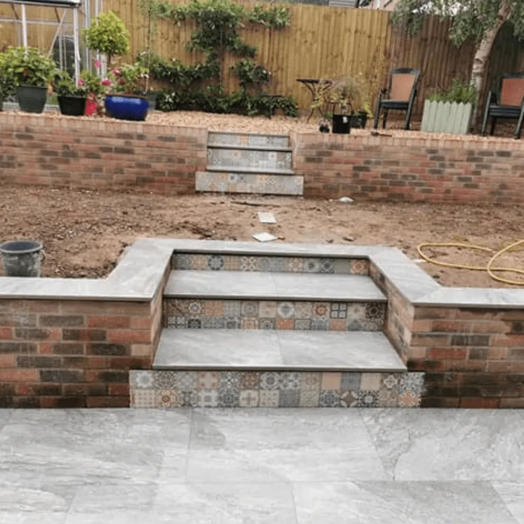 Split level garden with patterned tile steps in Cardiff