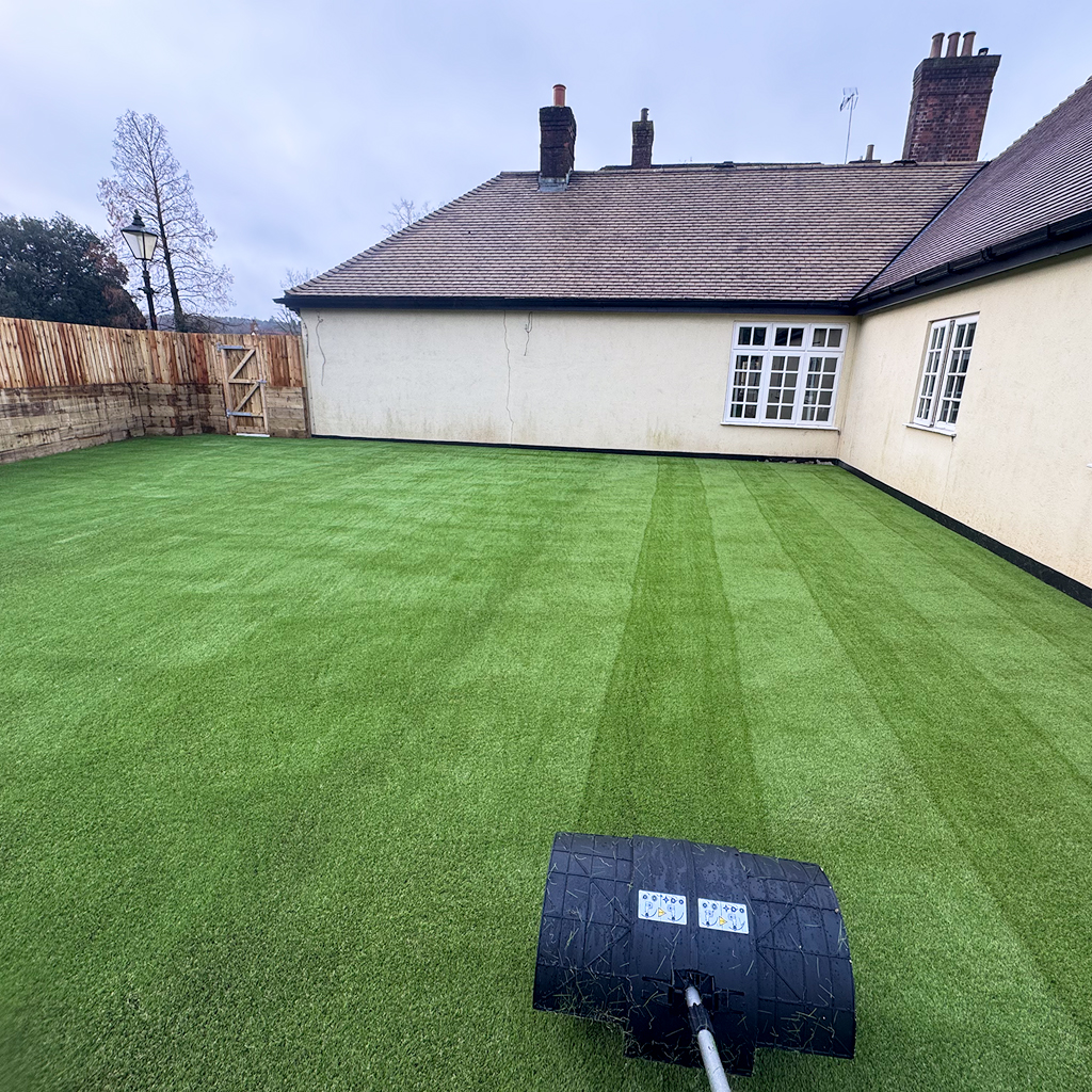 A large artificial grass, sleepers, and fencing landscaping project we finished in Cardiff