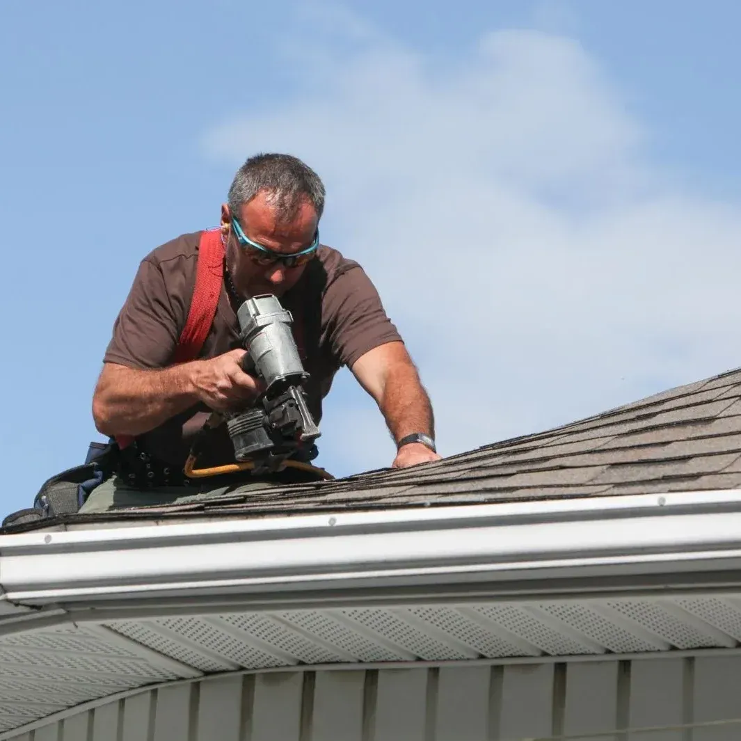 Roofer doing roofing