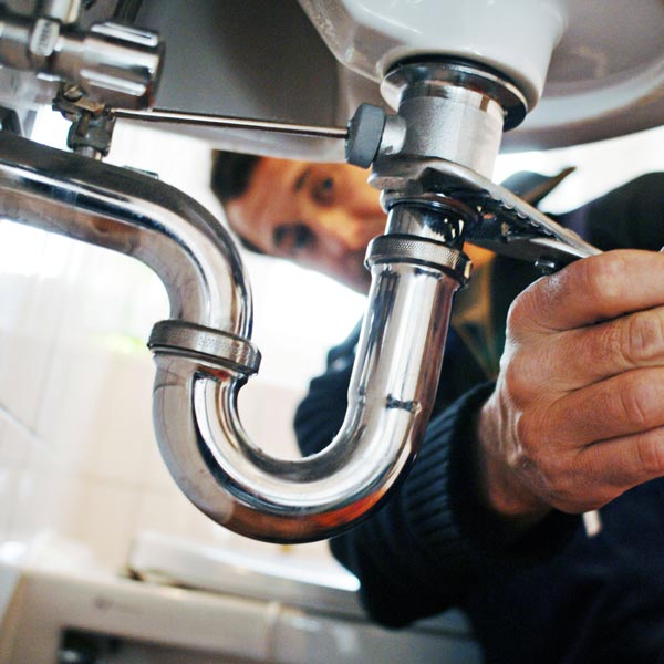plumber holding a wrench