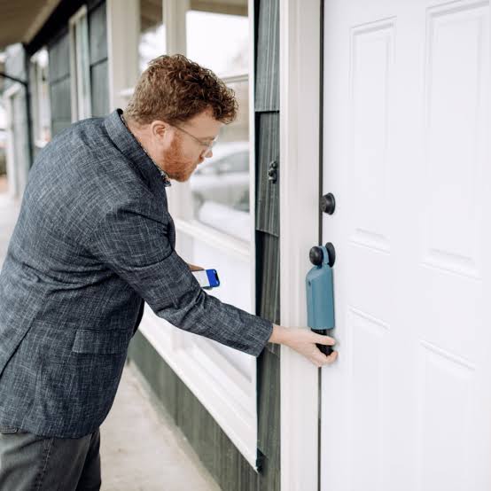 realtor opening a door