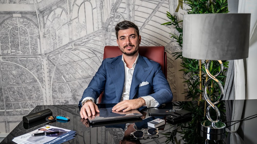 man standing in front of group of men