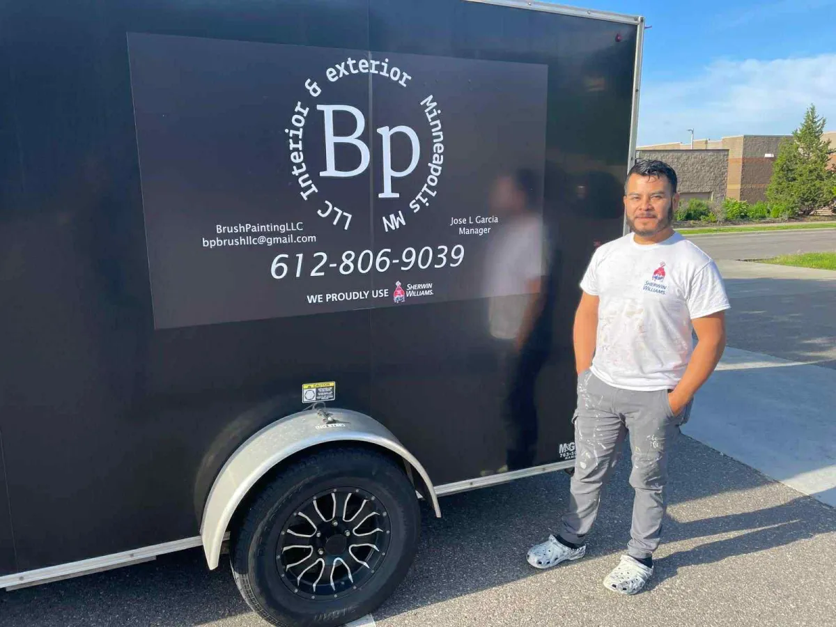 The owner Jose Garcia standing by his work trailer