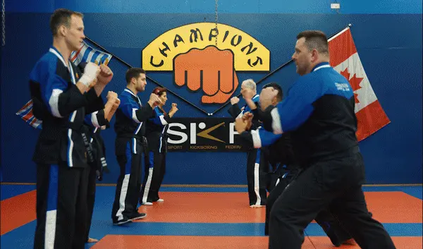 Student lifting weights in a modern gym