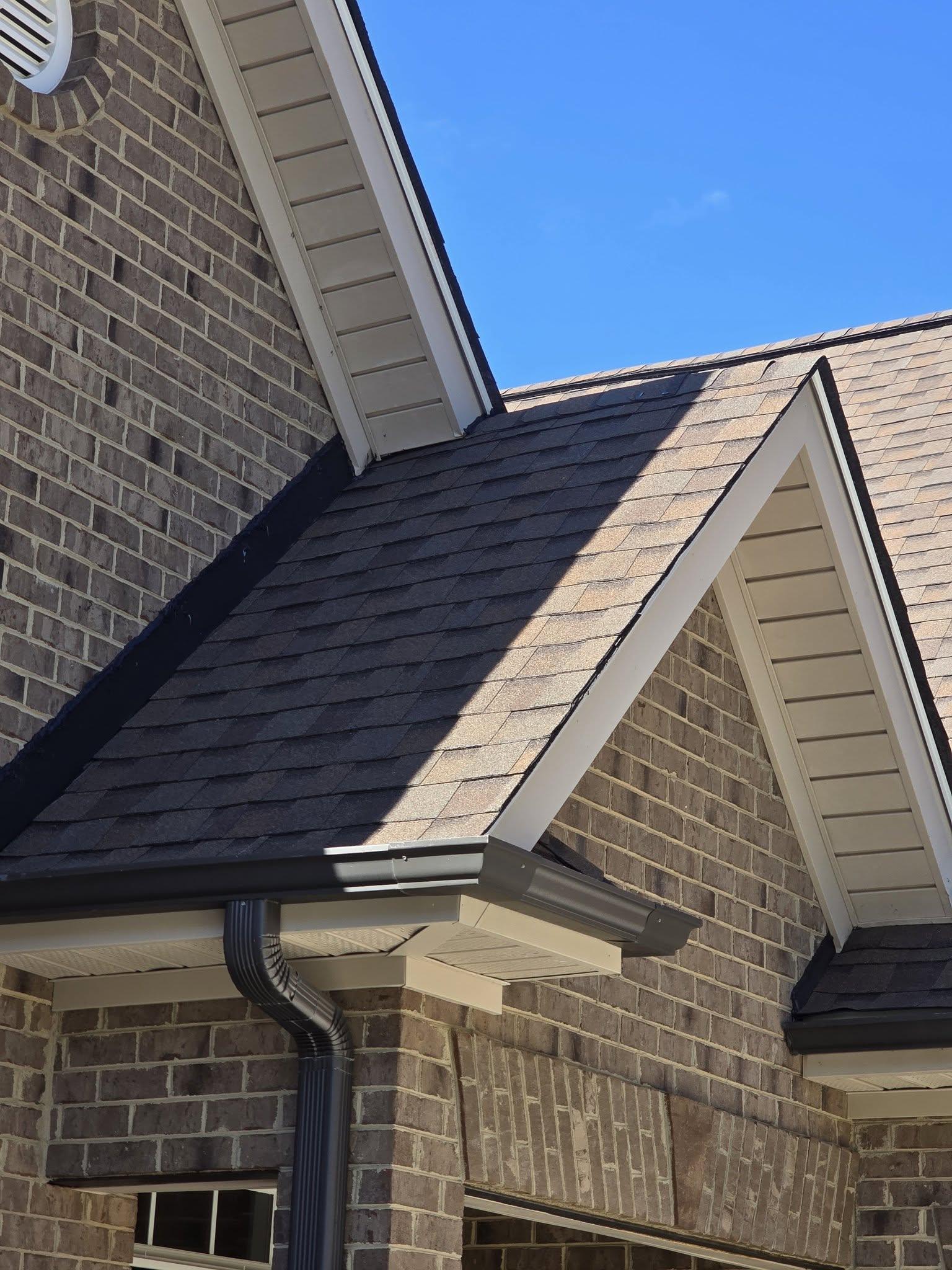 The roof of a building with a tree in the background