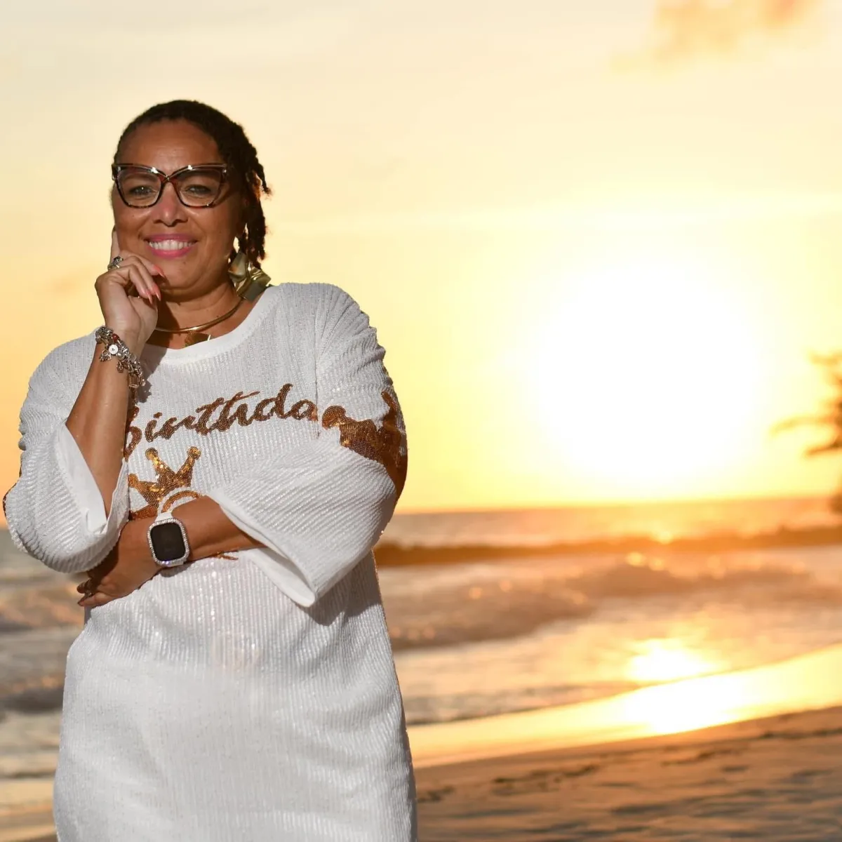 a man standing on top of a hill looking at the sky