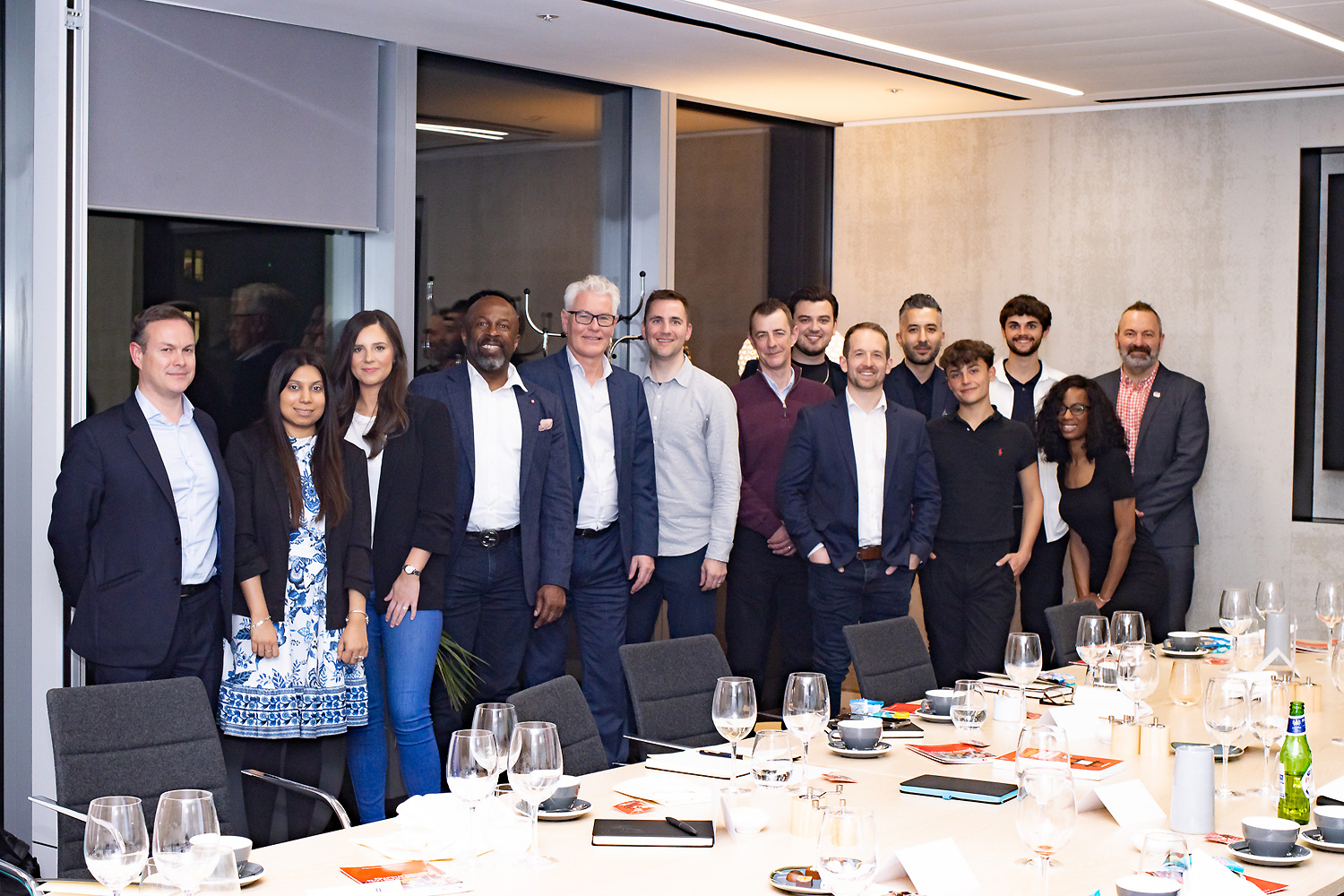 Business networking event with executives gathered around a private dining table in London, highlighting leadership connections, professional relationship building, corporate strategy, and executive brand growth.