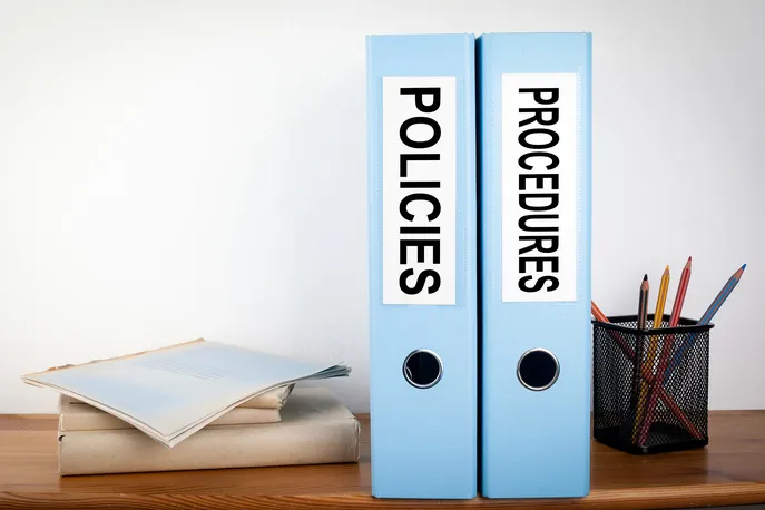 man in white dress shirt sitting beside woman in black long sleeve shirt