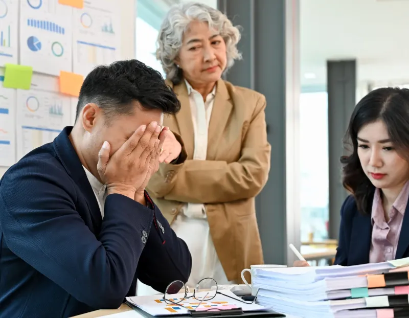 woman placing sticky notes on wall