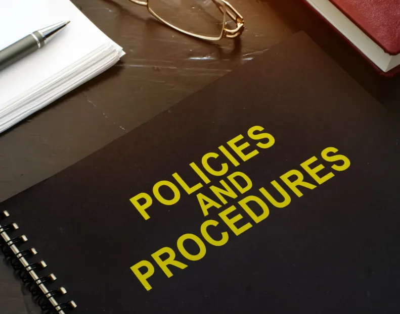 man in white dress shirt sitting beside woman in black long sleeve shirt