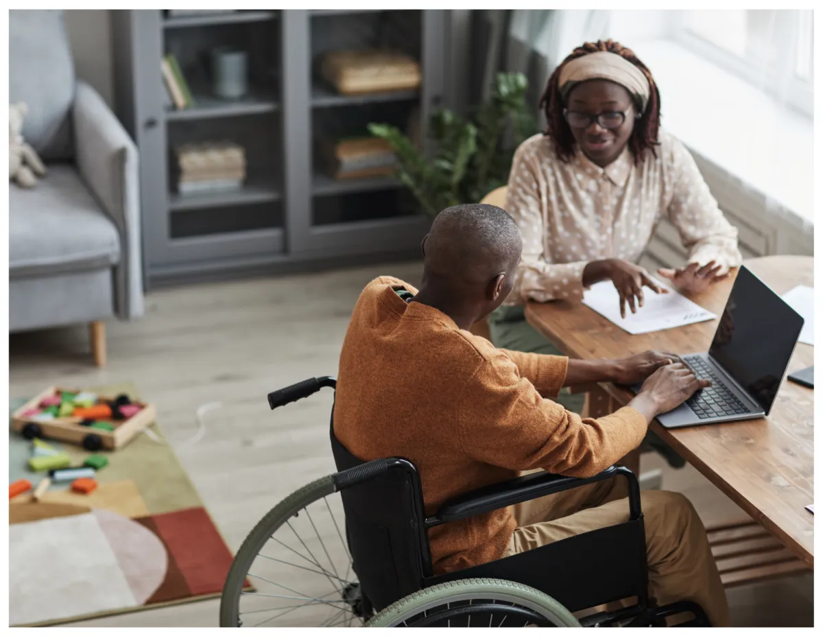 man in white dress shirt sitting beside woman in black long sleeve shirt