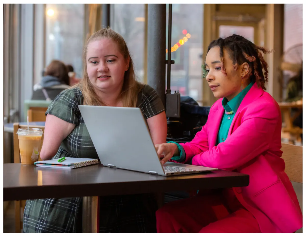 man in white dress shirt sitting beside woman in black long sleeve shirt