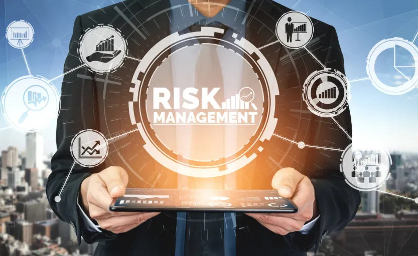 man standing behind flat screen computer monitor