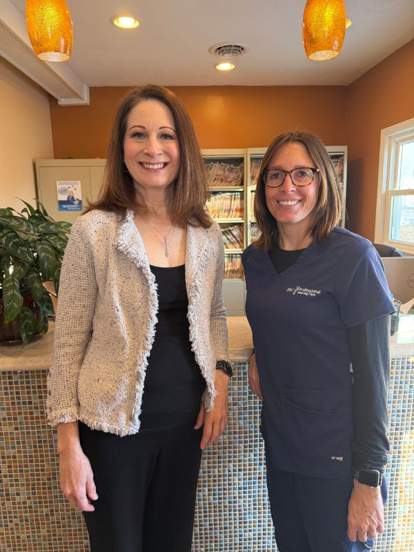 Dr. Stout and Alyssa standing in the lobby of their office
