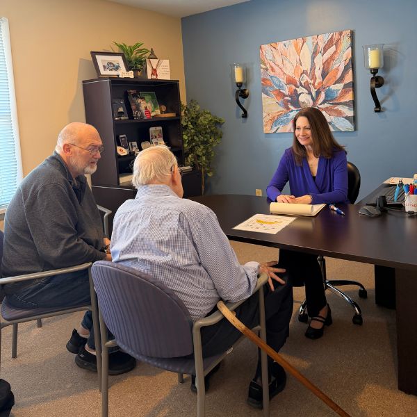 Dr Stout meeting with two patients
