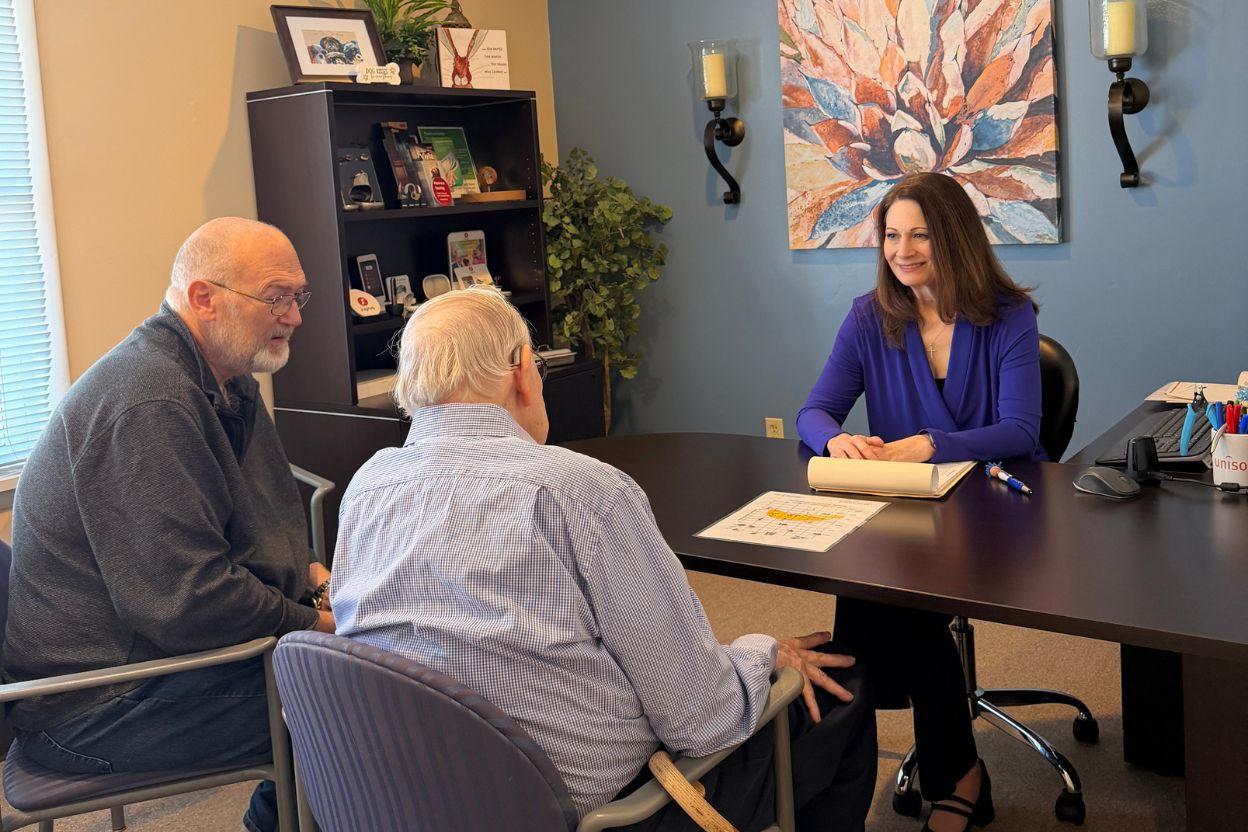 Dr Stout meeting with two patients