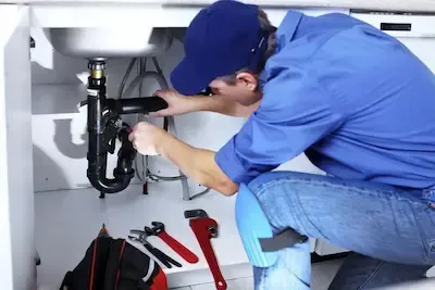 Plumber fixing under-sink drain and P-trap assembly in Gahanna
