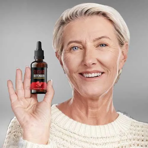 "Happy customer holding Sugar Defender supplement – real user sharing their positive experience with blood sugar support."