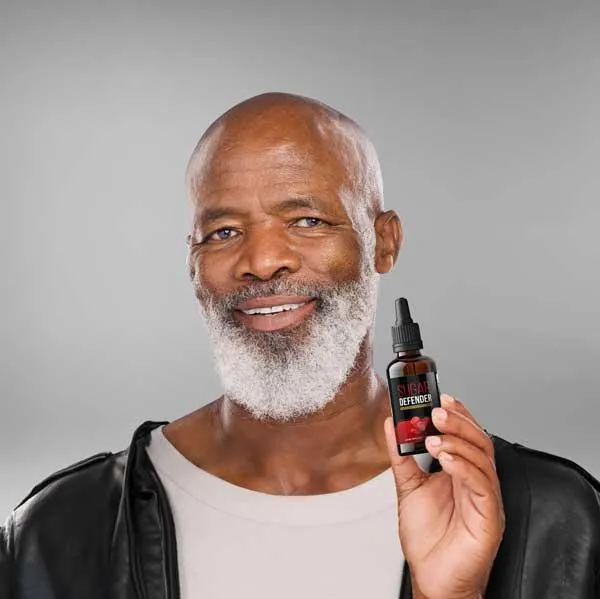 “John Michael Anderson, happy male customer holding Sugar Defender Official Supplement bottle, showing improved energy and blood sugar support”