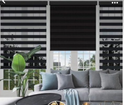 Dark gray zebra shades complementing a modern living room interior