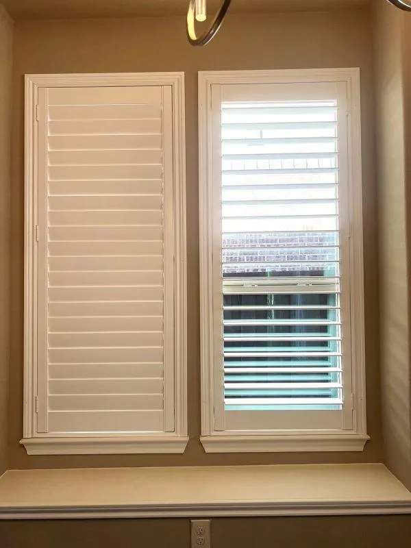 Full height plantation shutters fitted to two narrow windows