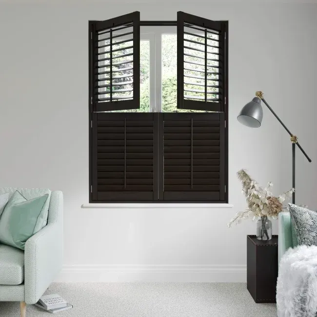 Dark wood tier-on-tier shutters installed on a small window