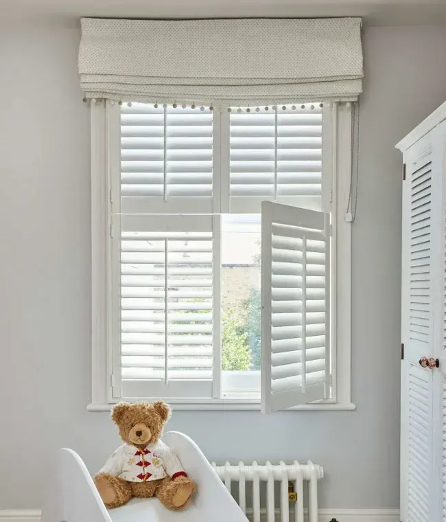 White tier-on-tier plantation shutters fitted to adjacent windows