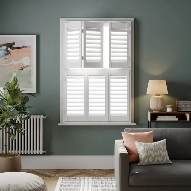 Tier-on-tier shutters providing adjustable privacy in a living room