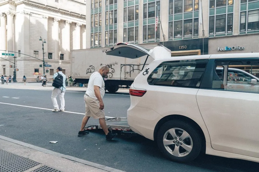 a man loading the back of his mini van