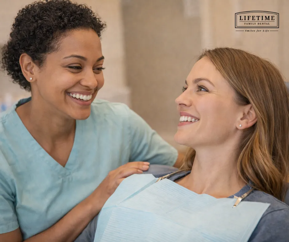 Friendly dental hygienist smiling with patient — warm, natural, genuine. Not overly clinical. Diverse representation ideal.