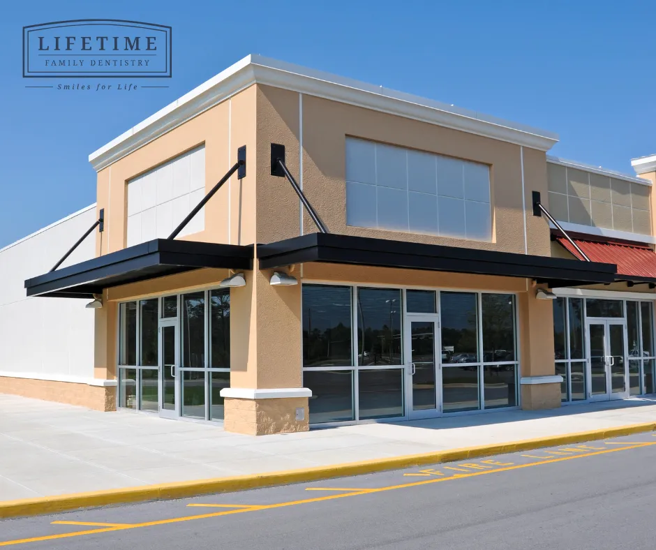 Bright, welcoming exterior or reception area of a modern dental office — warm lighting, family-friendly aesthetic. No stock clipart.