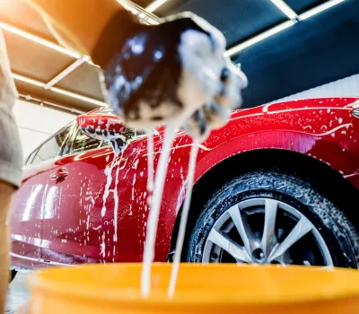 Red car getting washed