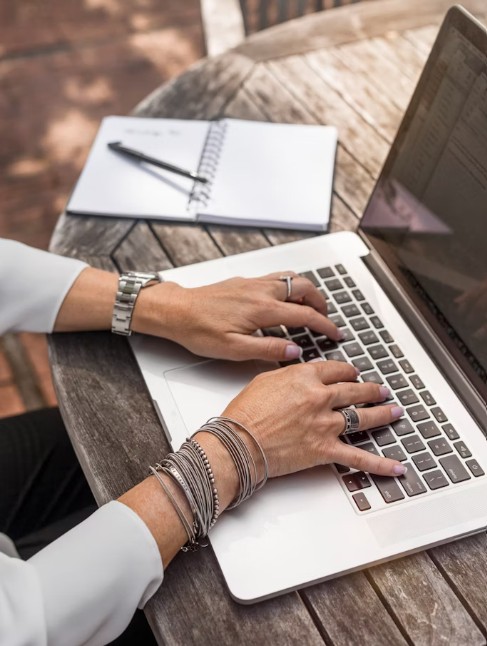 Person typing on laptop