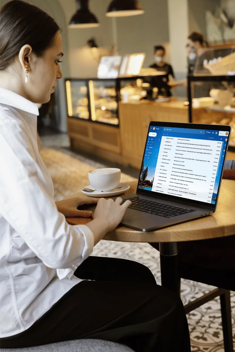 Woman on laptop reading emails