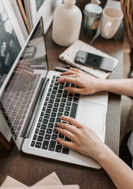 lady typing at laptop