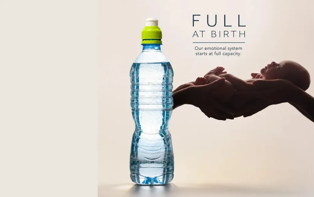 A new born and a full bottle of water
