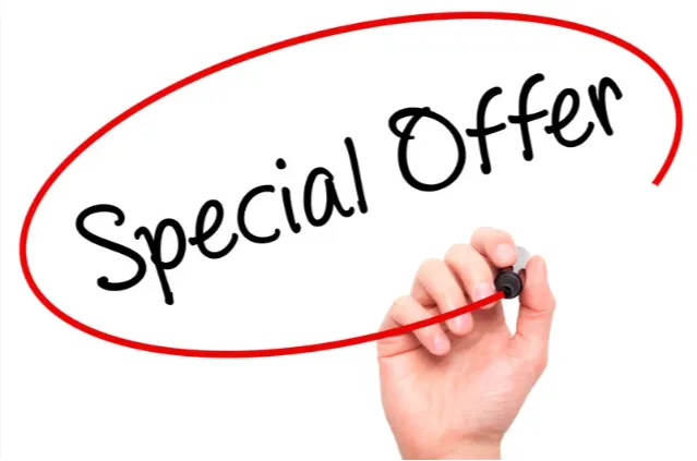 a kitchen with a sink and a lot of clutter on the counter