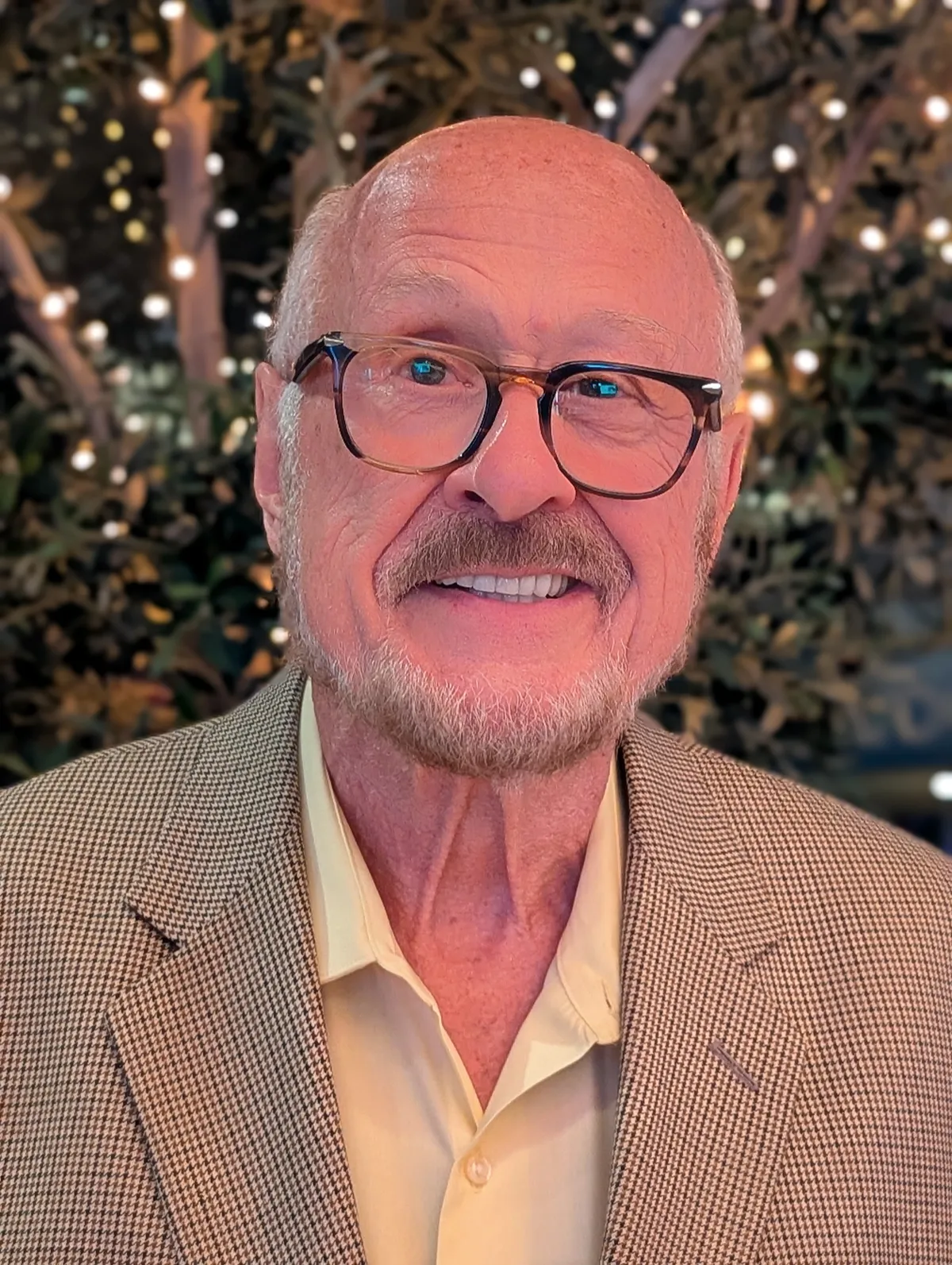 Dennis Parnell, LCSW - Author, Speaker, Coach, and Therapist in a contemplative editorial portrait