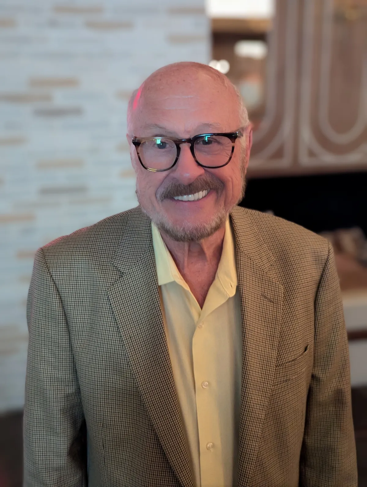 Dennis Parnell, LCSW - Author, Speaker, Coach, and Therapist in a contemplative editorial portrait