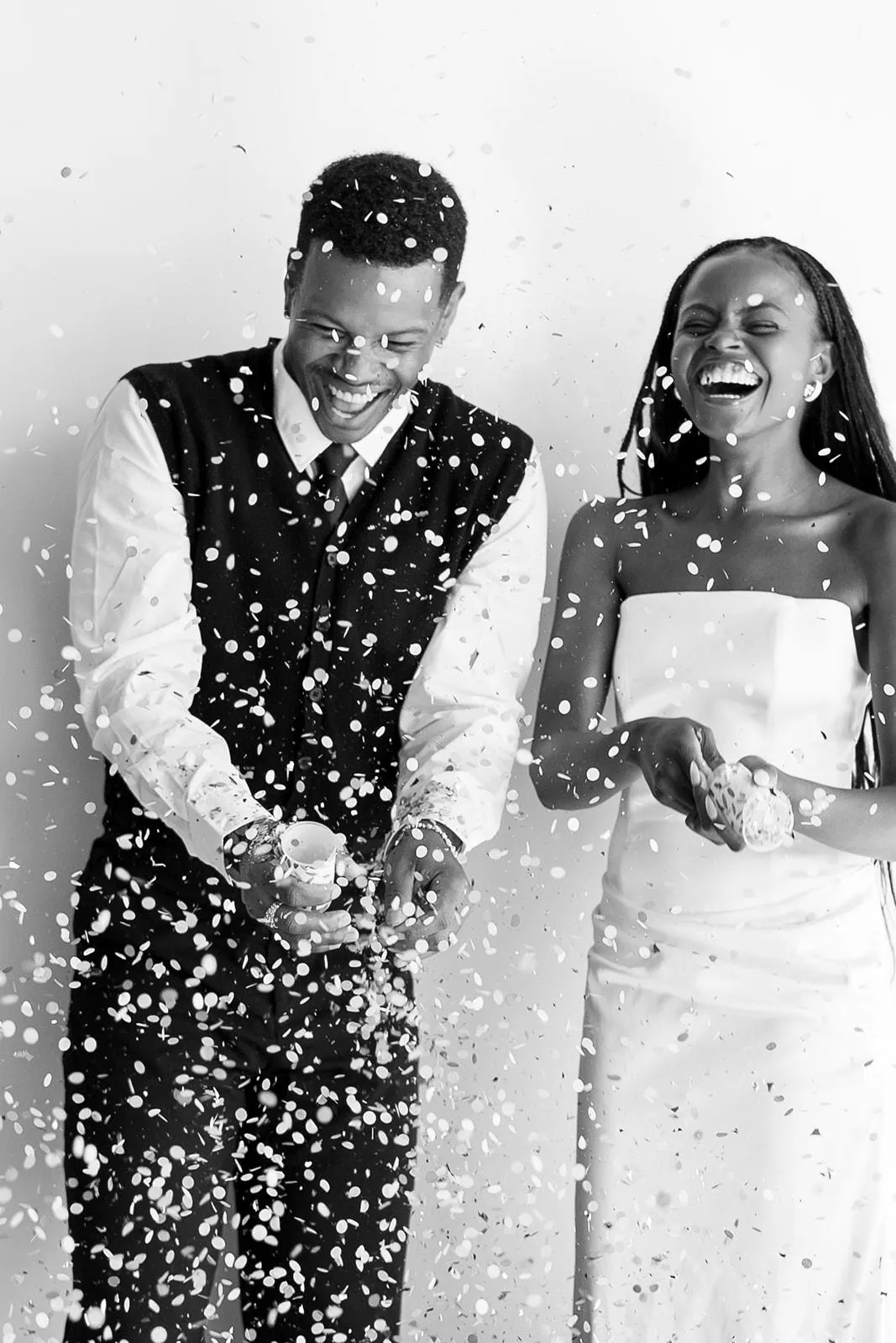 glam bride and groom having fun in a photo booth at their luxury wedding in Colorado Springs