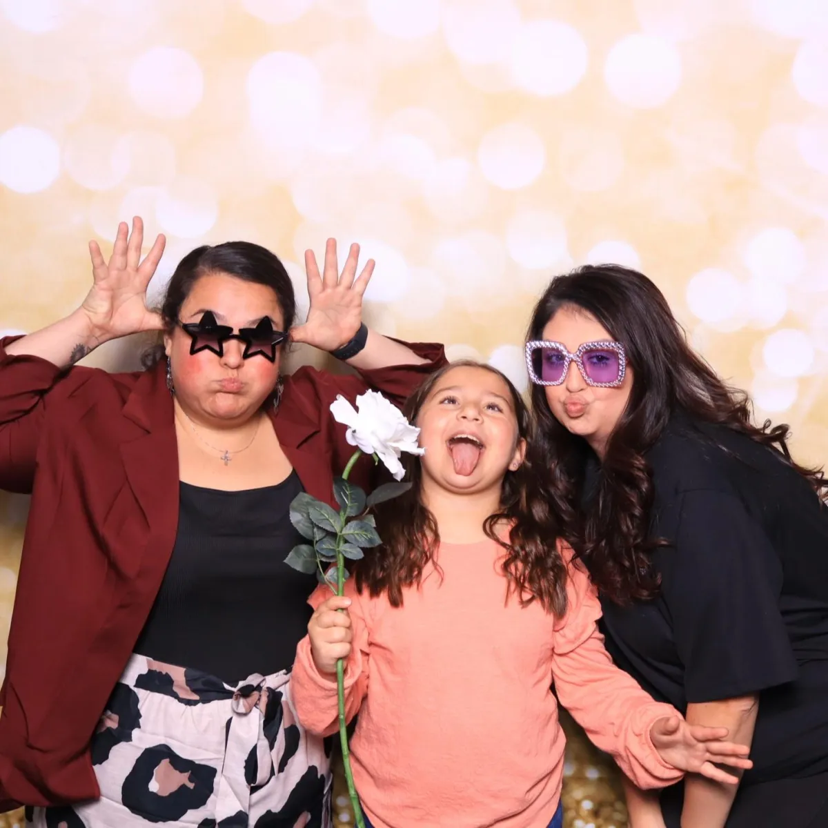 Family enjoying Martini Moment Photo Booth with props at Bingo, Bags & Heroes event for Pueblo Crime Stoppers at Pueblo Convention Center